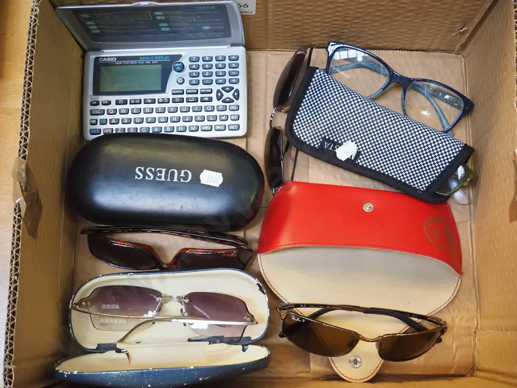 reading glasses, sunglasses, Casio digital diary Image 1++