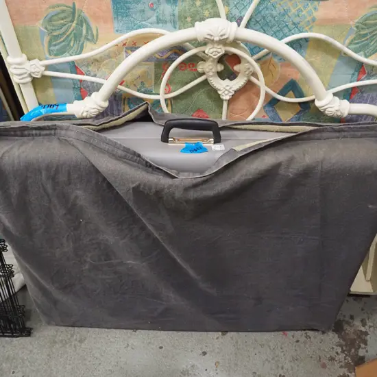 grey vinyl massage table in carry case