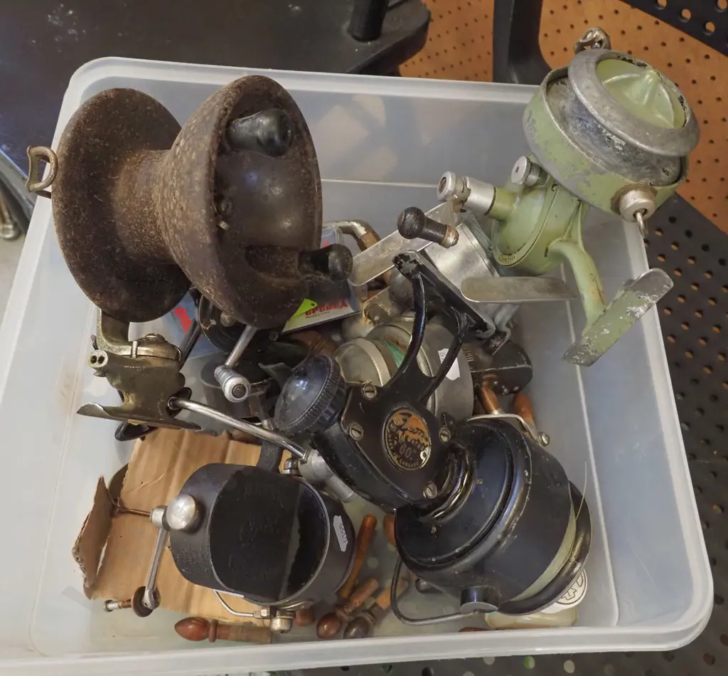 tub of fishing reels and lures Image 1++