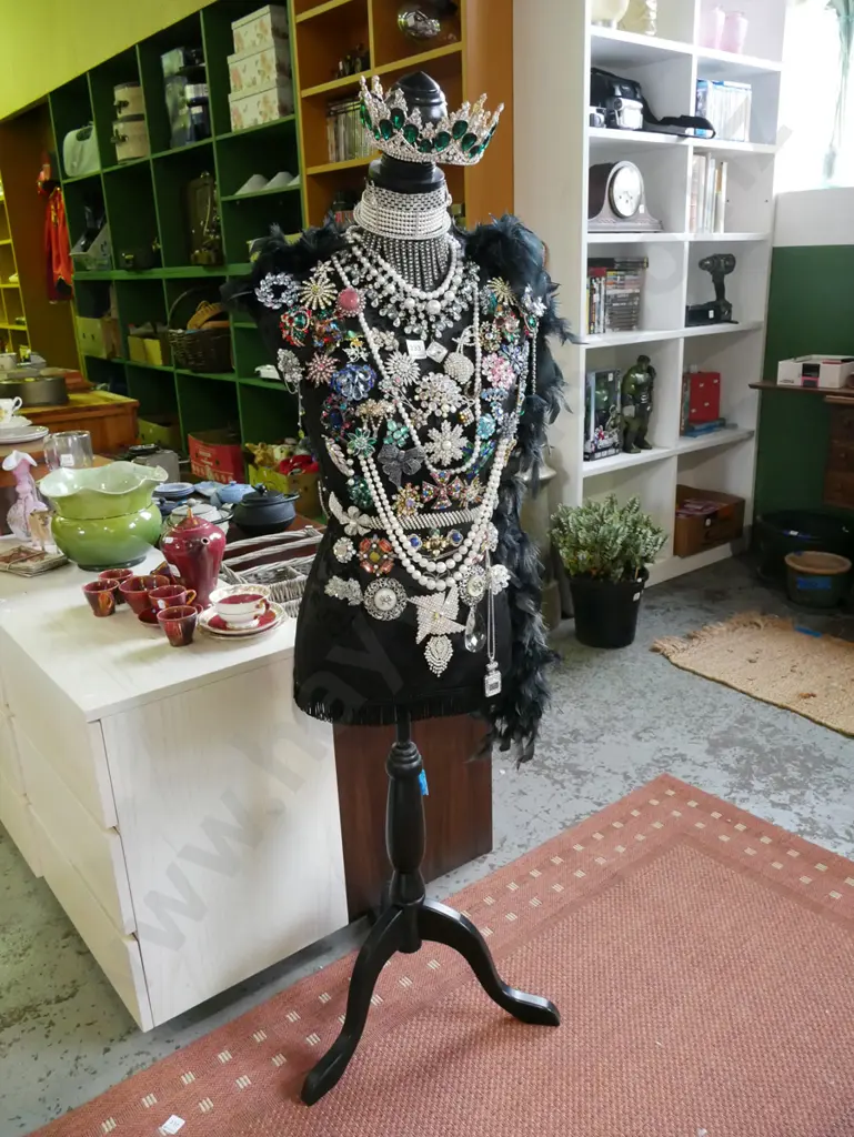 mannequin torso on stand - decorated with feather boa and numerous costume brooches and tiara Image 1++