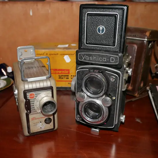 Kodak 8mm cine camera with box and Yashica-D twin lens reflex camera with case