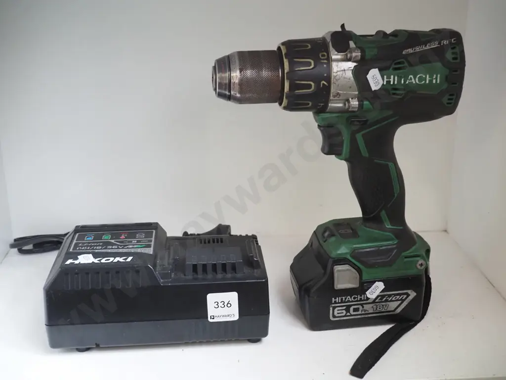 Hitachi battery powered drill with charger Image 1++