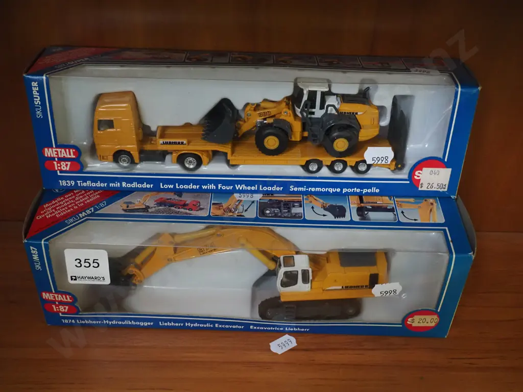2x boxed scale models of low loader and 4 wheel loader, excavator Image 1++