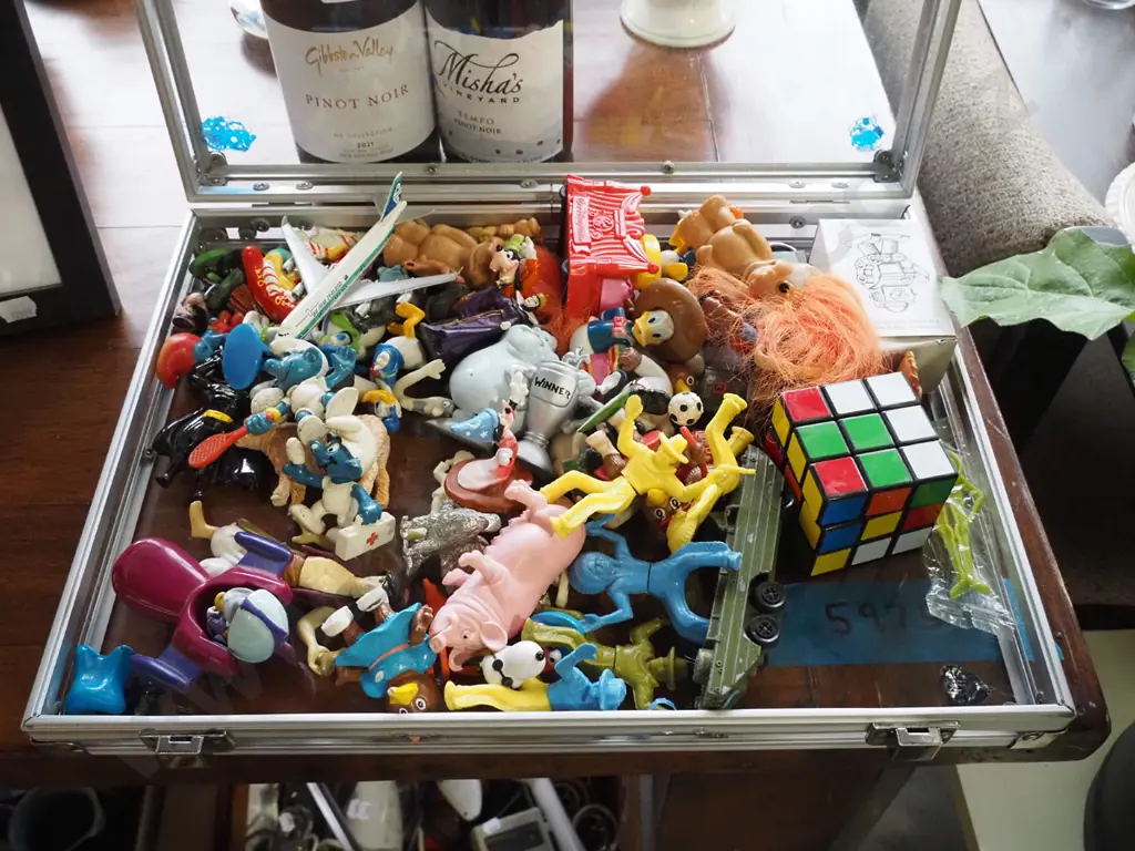 clear briefcase of various toys Image 1++