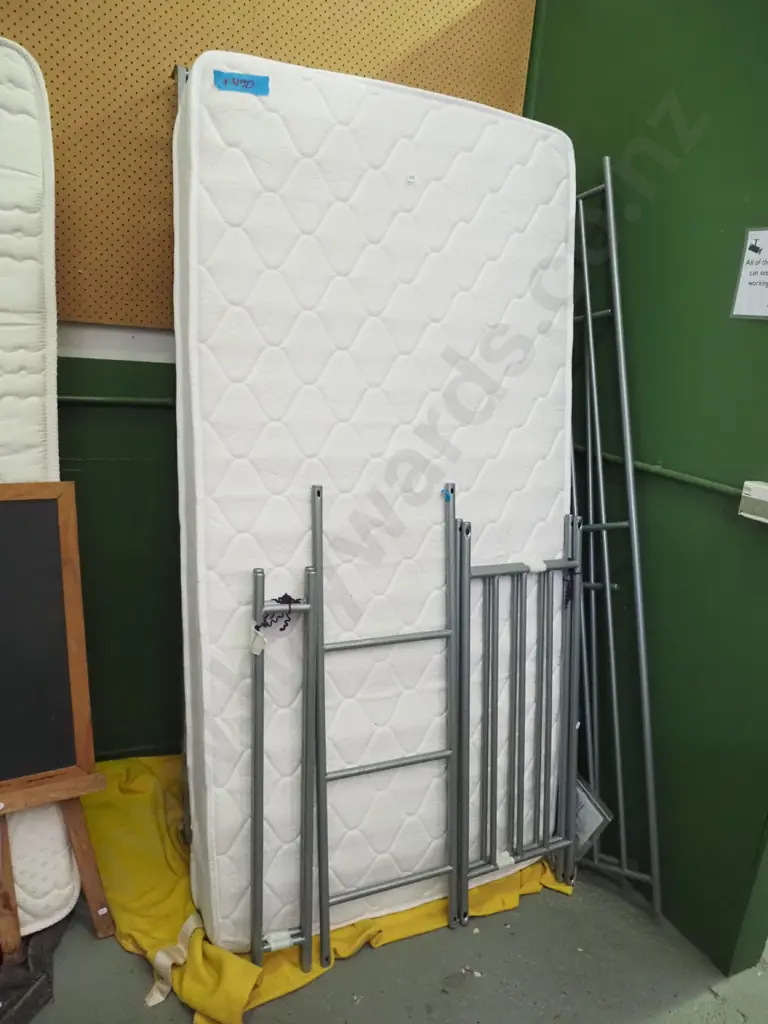 pair of metal based bunk beds with mismatched mattresses Image 1++