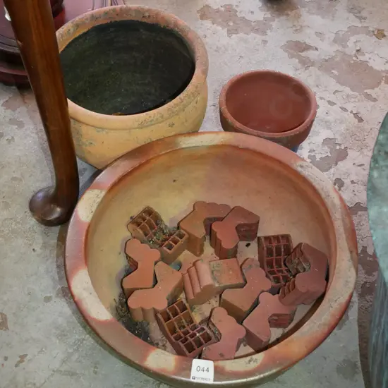 3x terracotta planters and pot plant feet
