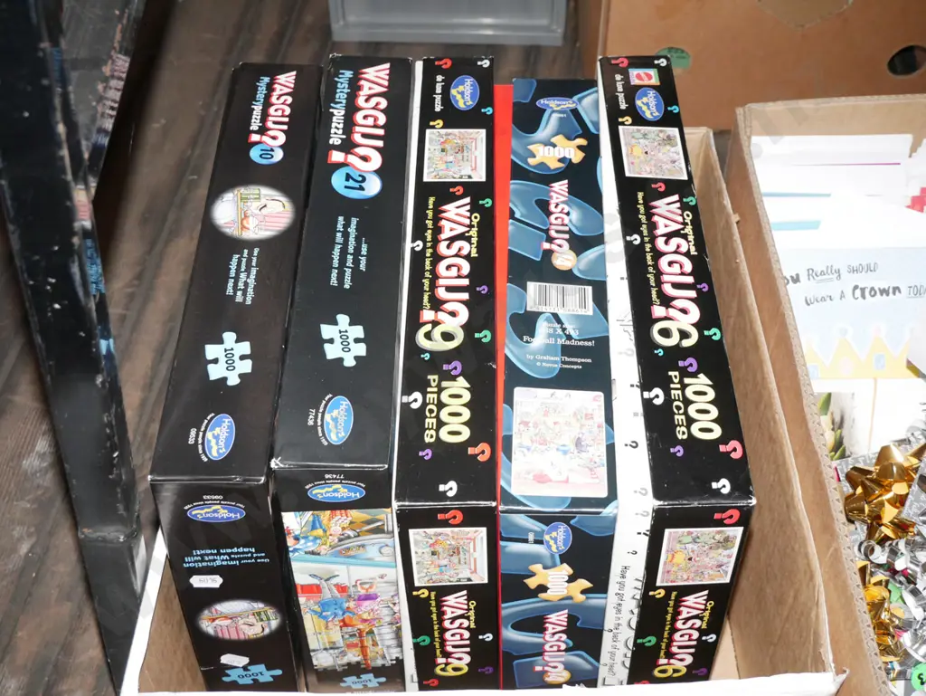 box of wasgij puzzles Image 1++