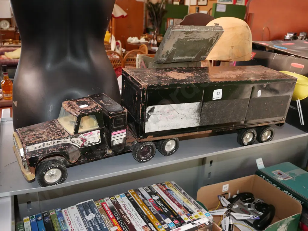 battered and beaten toy truck and trailer unit Image 1++