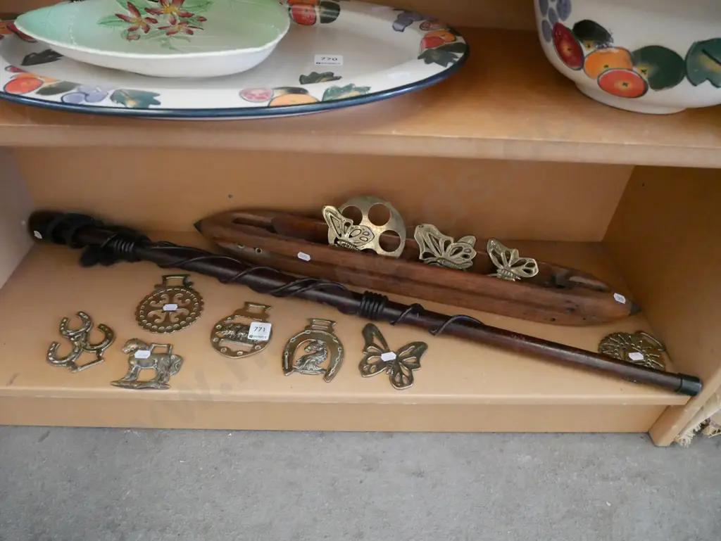 shelf; horse brasses, brass ornaments, carved walking stick etc Image 1++