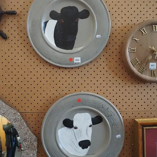 2x cow paintings on wooden plates