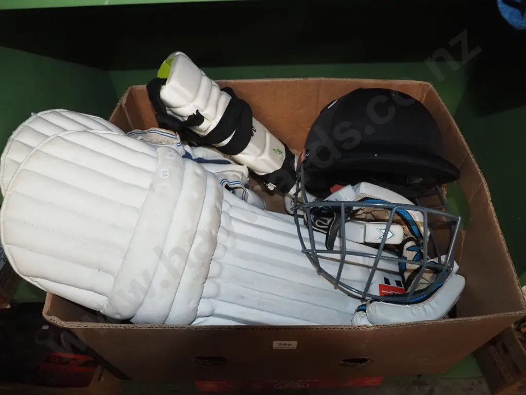box; cricket gloves, pads, and helmet Image 1++