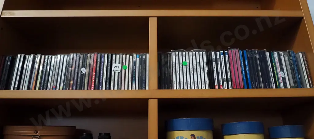 2x shelves of CDs - green dots Image 1++