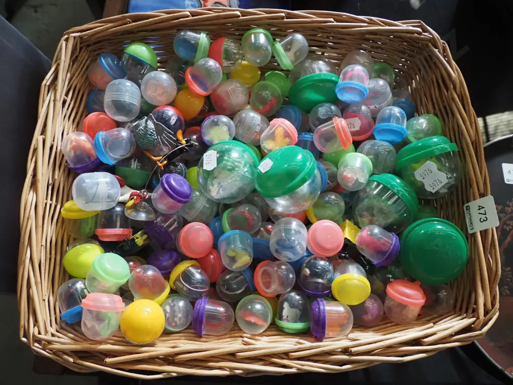cane basket, various plastic toys in plastic domes Image 1++