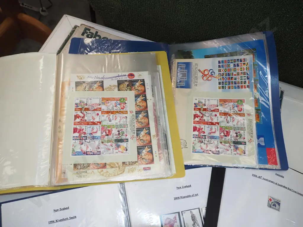4 clear files of stamps Image 1++
