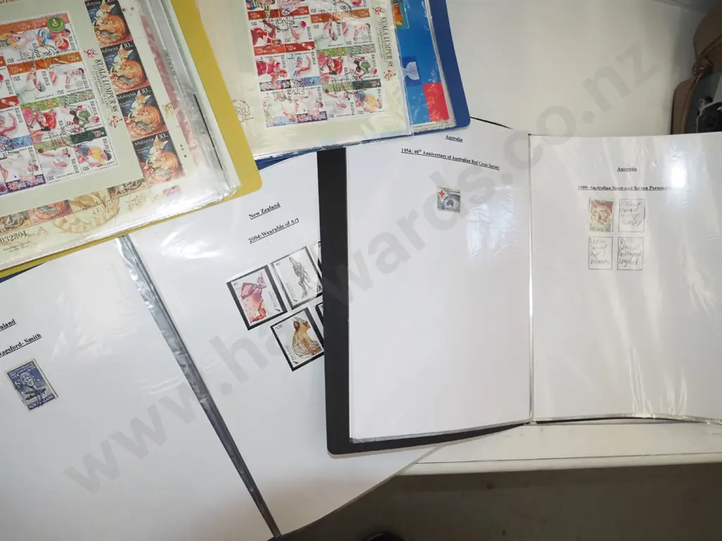 4 clear files of stamps Image 1++