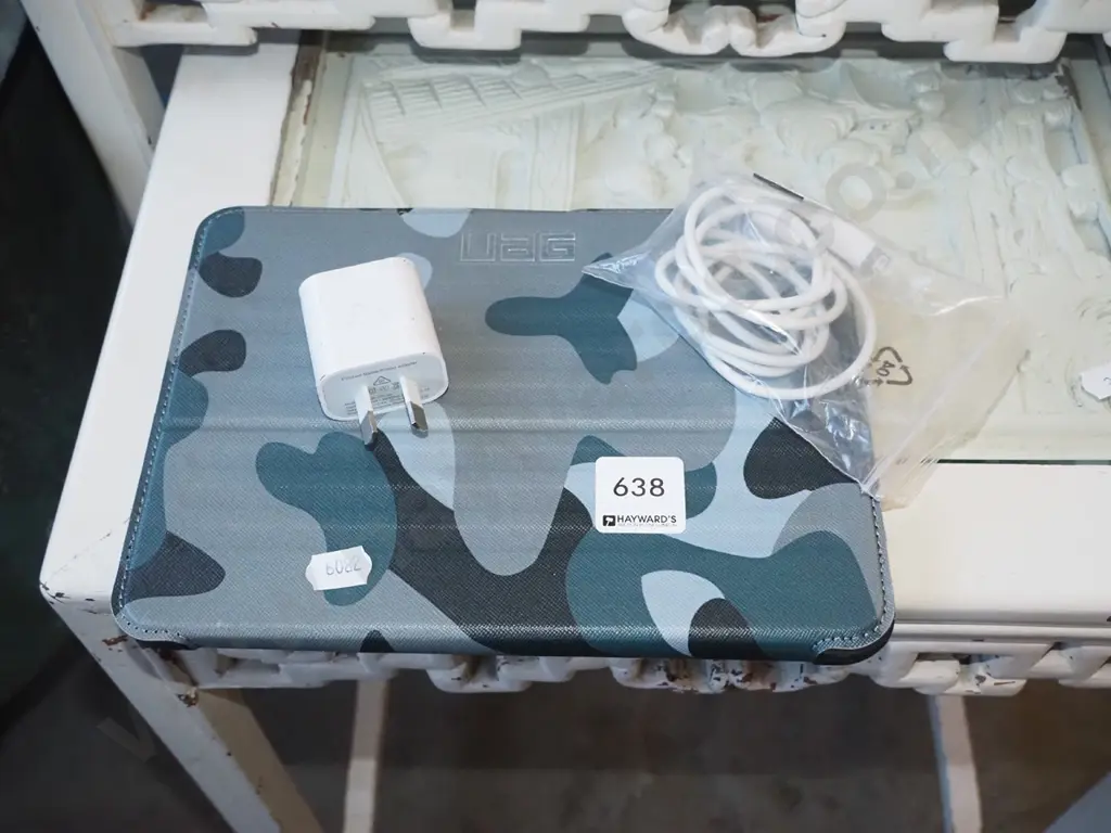 small tablet in UAG case with charger Image 1++