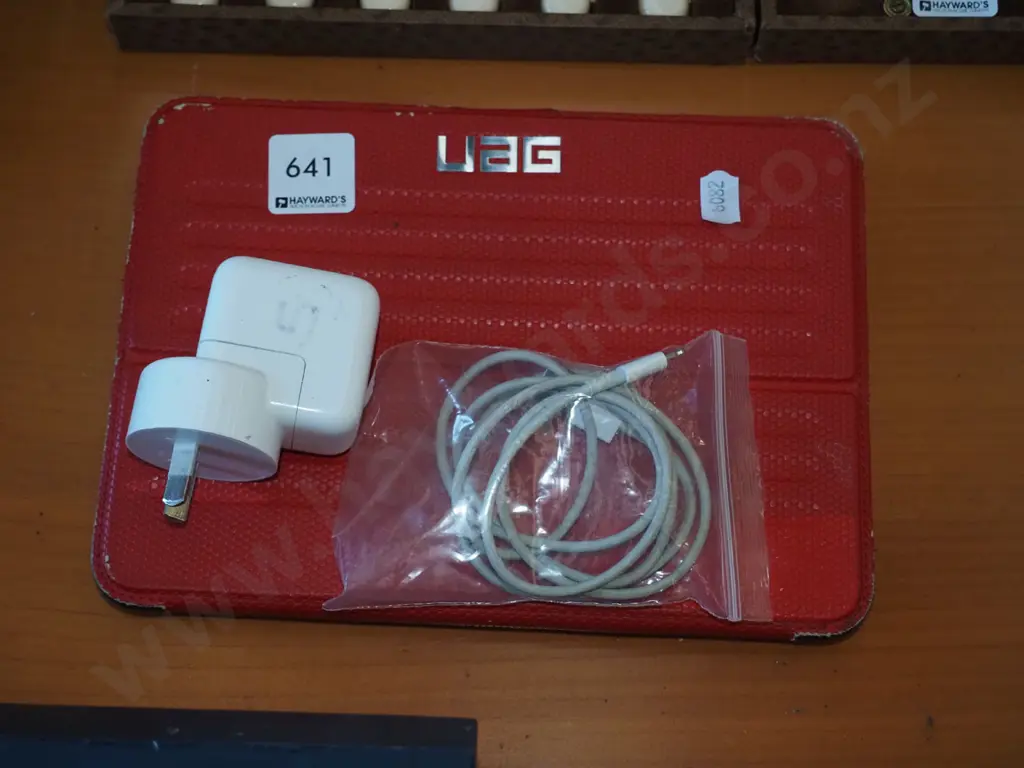 tablet in UAG case with charger Image 1++