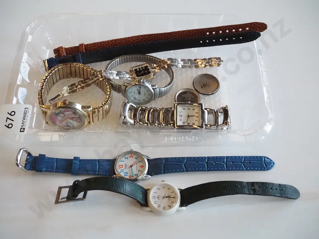 tray of wristwatches Image 1++