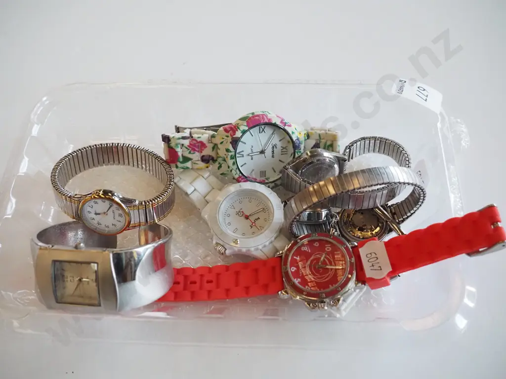 tray of wristwatches Image 1++