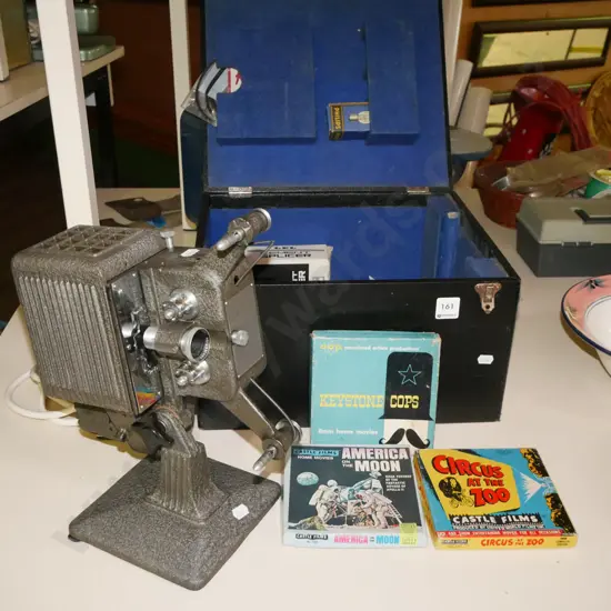 box; vintage 8mm cine projector, various films