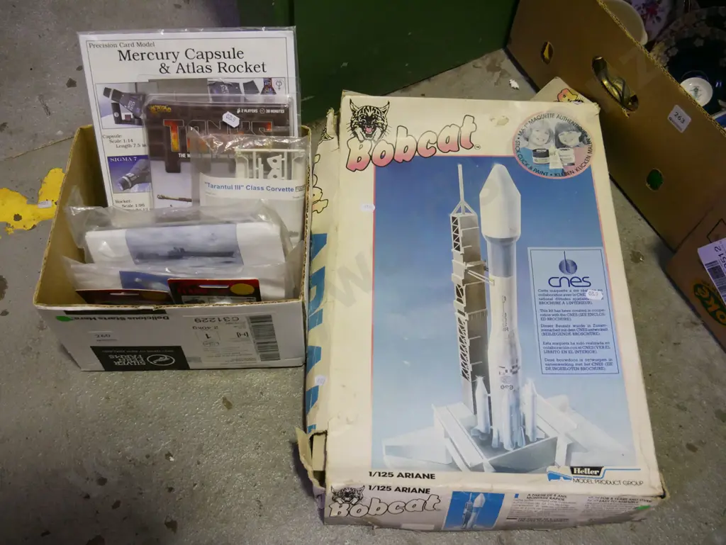 box of yet to be assembled rocket, box of unassembled models Image 1++
