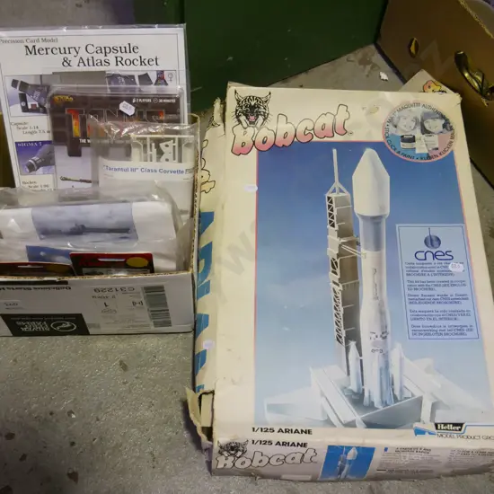 box of yet to be assembled rocket, box of unassembled models