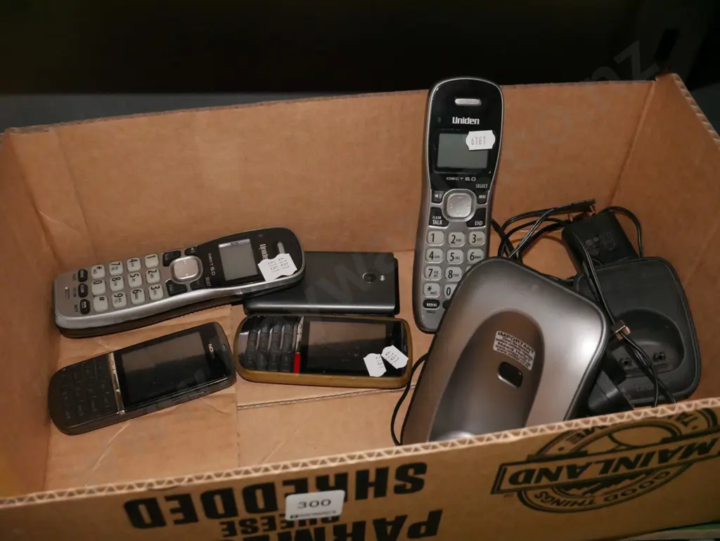 box; 2x Uniden phones,  cell phones Image 1++