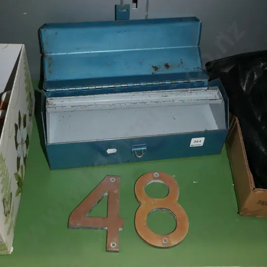 metal toolbox and brass numbers 4 and 8