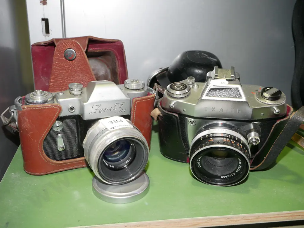 2x leather cased 35mm film cameras Image 1++