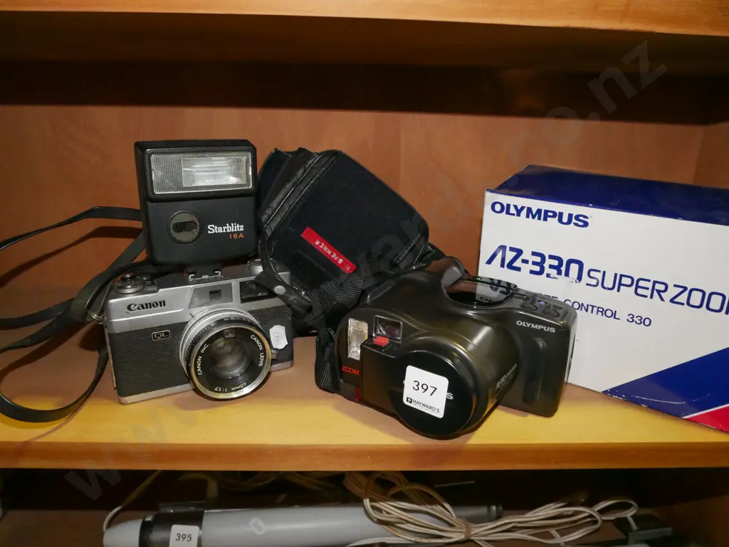 Canon 35mm camera, Olympus AZ superzoom camera Image 1++