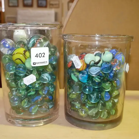 2x containers of marbles