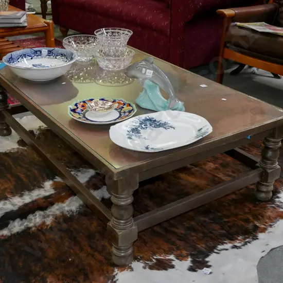large coffee table with etched copper world map and glass top