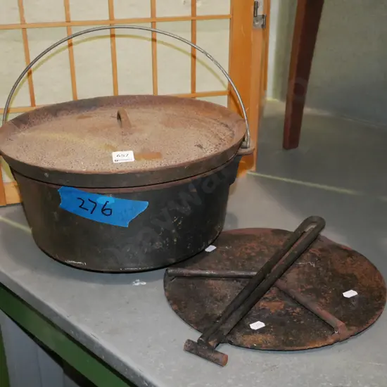 rusty cast iron Dutch oven, camp fire skillet