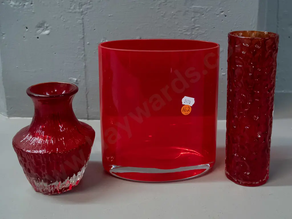 3 red art glass vases - 2 textured moulded, taller is H-200, and an oval cylinder Image 1++