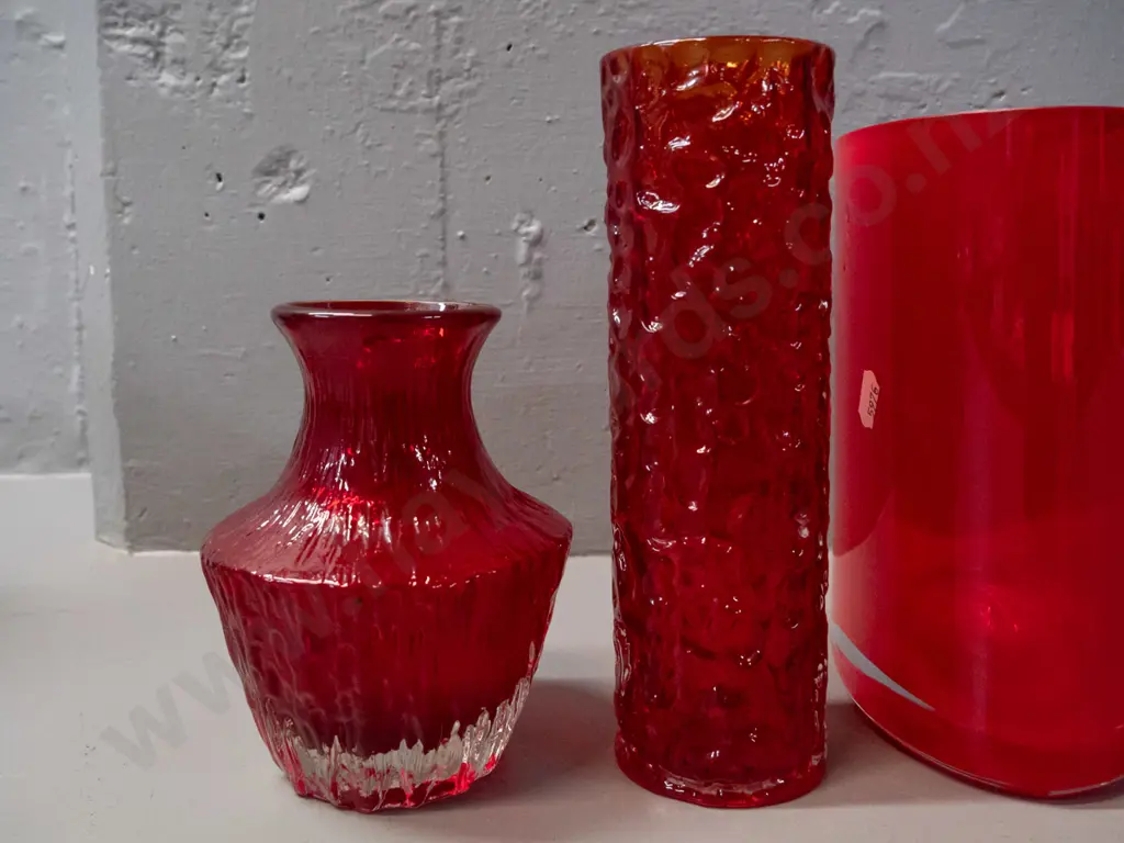 3 red art glass vases - 2 textured moulded, taller is H-200, and an oval cylinder Image 1++