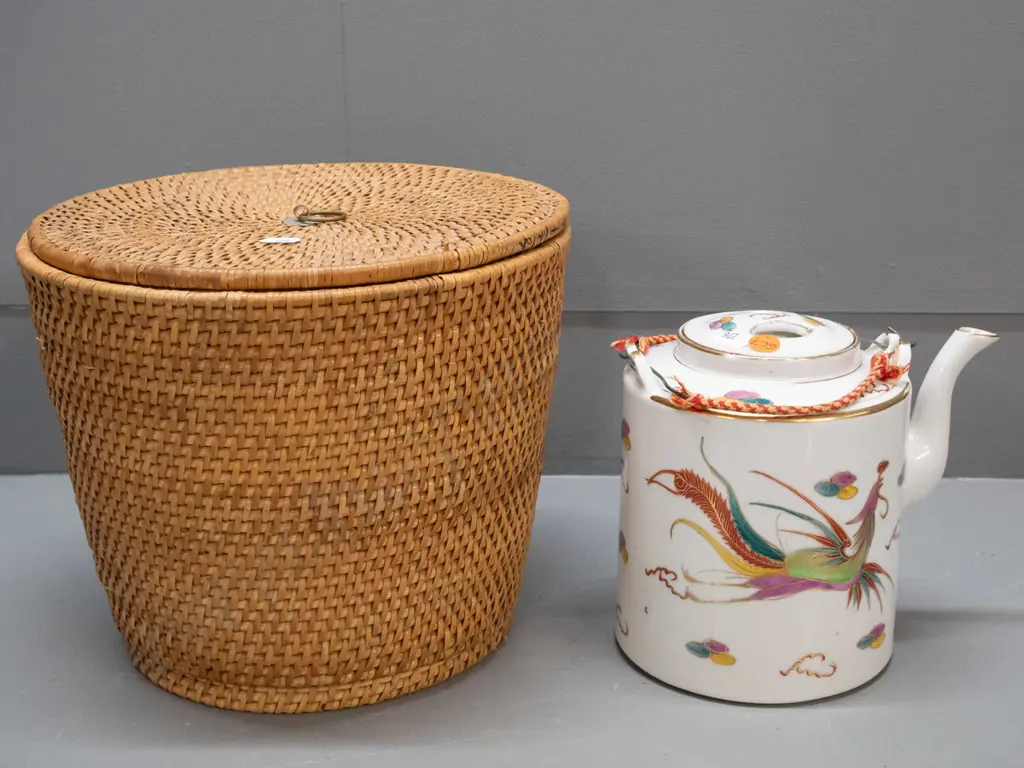 Chinese teapot in fitted & insulated cane & fabric holder, wire and woven fabric handles have some fraying, chip to rim Image 1++