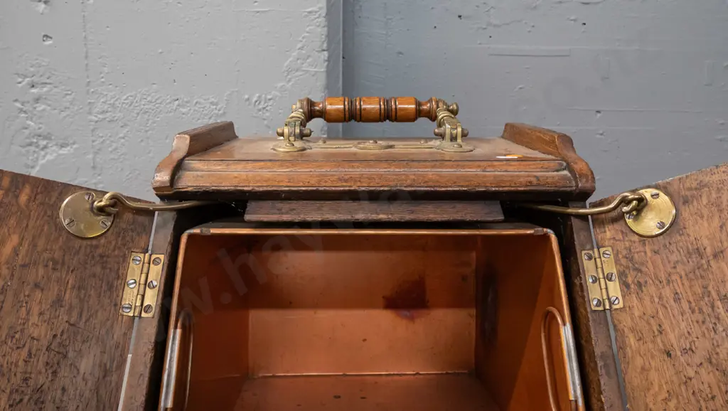 vintage oak coal scuttle with brass door-opening mechanism connected to brass and timber top handle, with tin liner. Image 1++