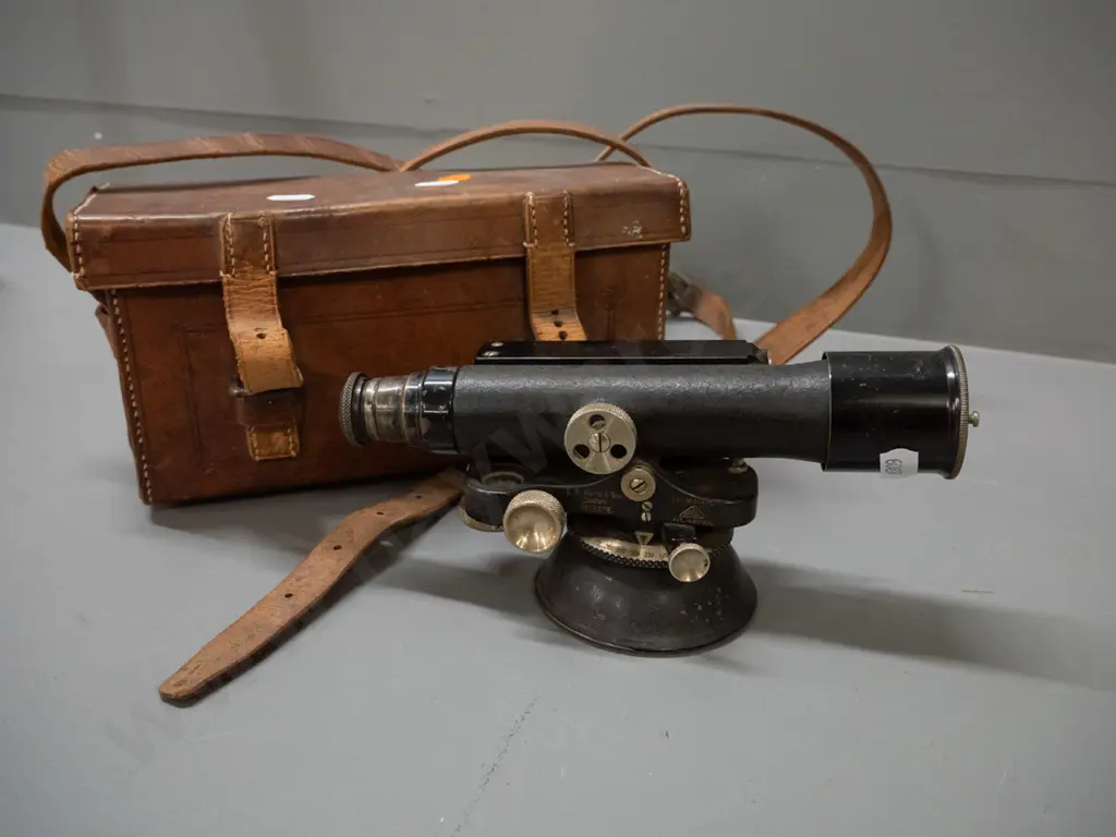 vintage surveyor's theodolite with wooden tripod, padded leather case, marked ER Watts London / Hugh & GK Neill Dunedin. Image 1++