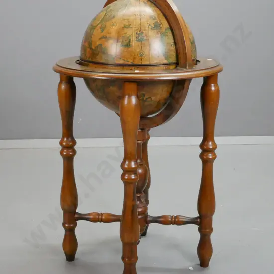 world globe drinks cabinet with spun metal globe on turned timber base with decanters and glasses, with