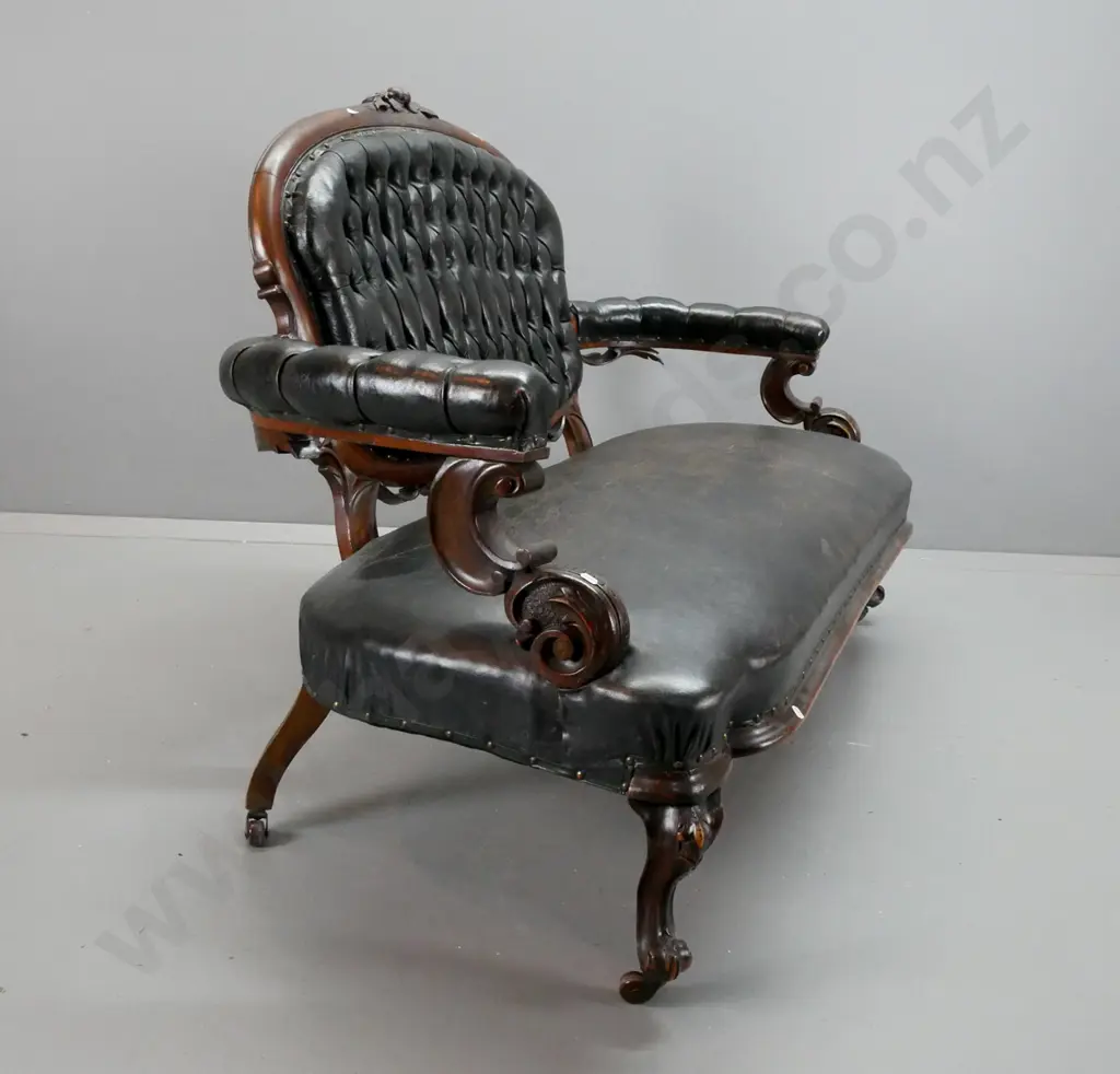 Victorian cameo-backed settee w/ black buttoned & pleated back, buttoned arms, studded seat, carved arms and back, on Image 1++