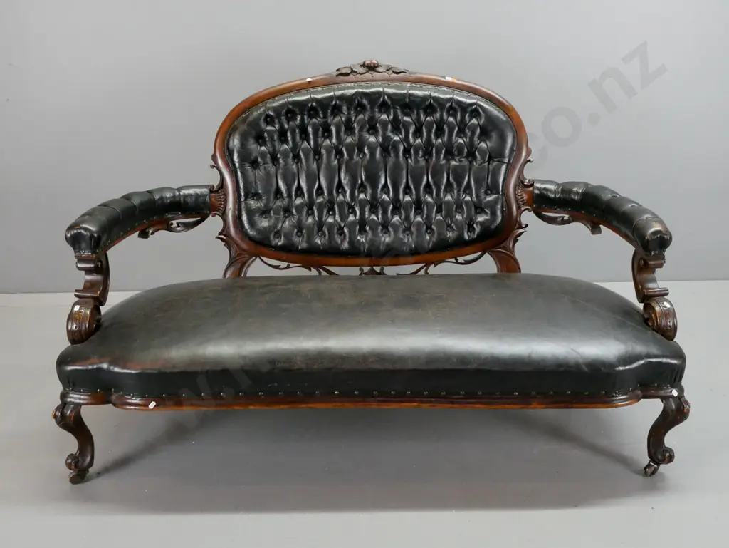 Victorian cameo-backed settee w/ black buttoned & pleated back, buttoned arms, studded seat, carved arms and back, on Image 1++