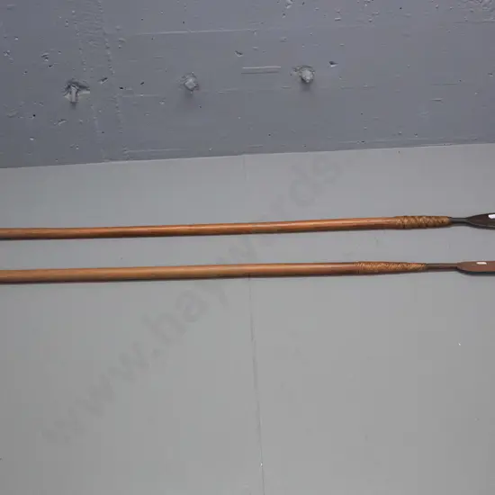 2 tribal spears with timber shaft, metal blades attached with woven cane. Some corrosion to blades, longer one is L-1480