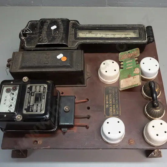 vintage electric meter board with assorted meters, fuses etc and a small fuse wire card - glass window on one meter is