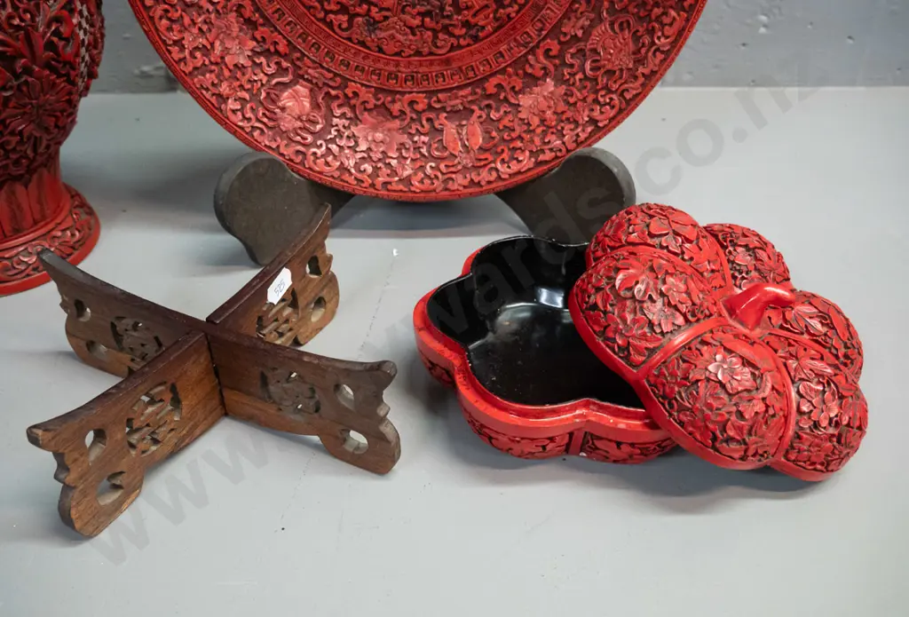 3 cinnabar style composite items - vase, plate with stand, and gourd shaped lidded container on pierced wooden stand. Image 1++