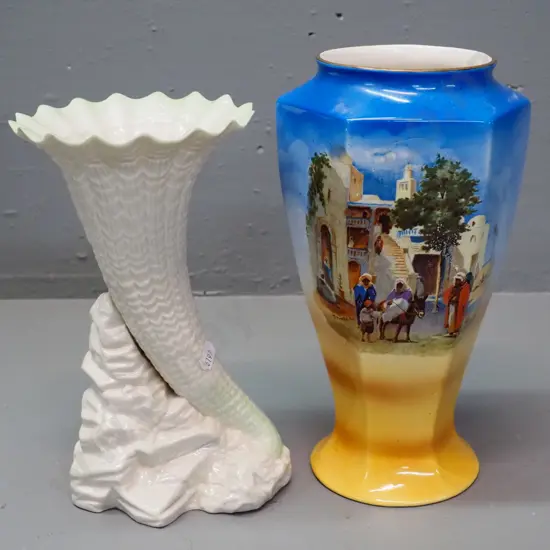 H&K Tunstall hand painted Arab street scene vase H-260 and a Belleek style shell vase with small fleck to rim