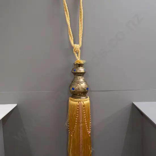 Chinese composite oversize ornamental tie-back with braided gold cord hanger, inset faux jewel decoration, with Butler &