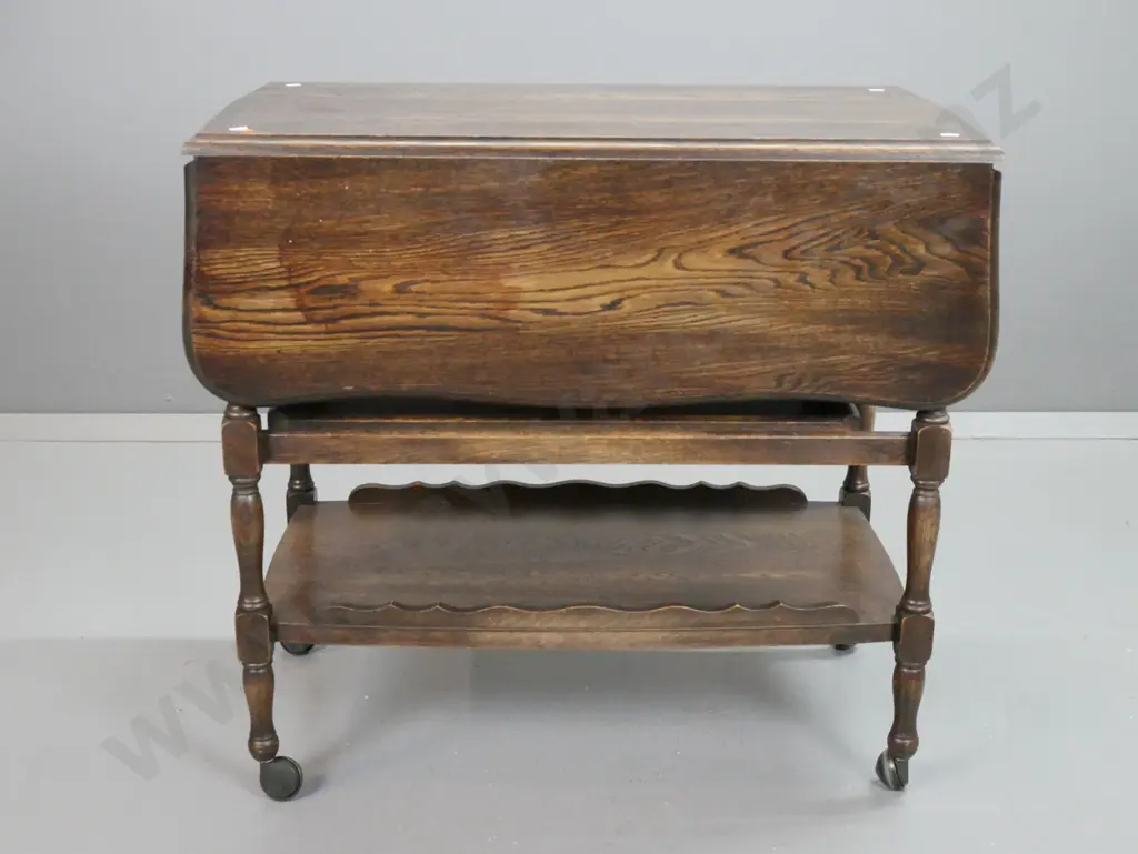 vintage oak drop-side tea trolley with shaped edge, single drawer, slide in serving tray and bottom shelf with shaped Image 1++
