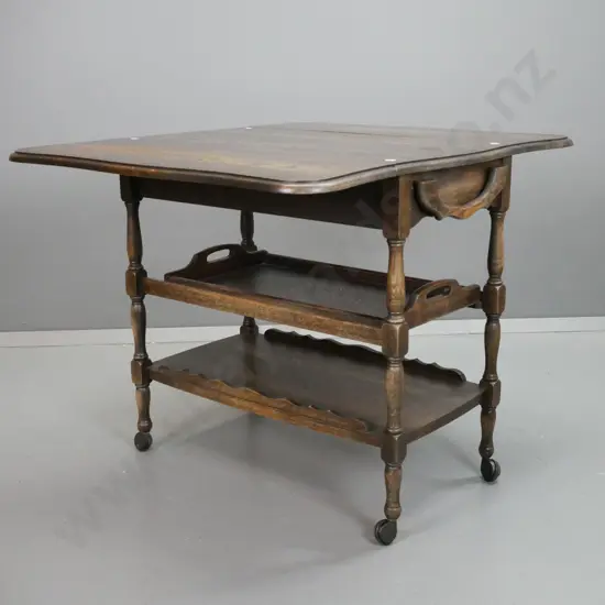 vintage oak drop-side tea trolley with shaped edge, single drawer, slide in serving tray and bottom shelf with shaped