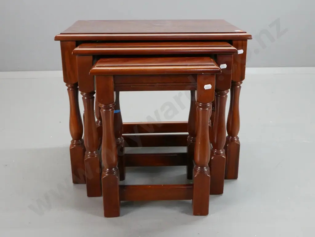set of 3 mahogany nesting tables with turned legs, block feet and stretcher bases - minor ding to edge of large table Image 1++