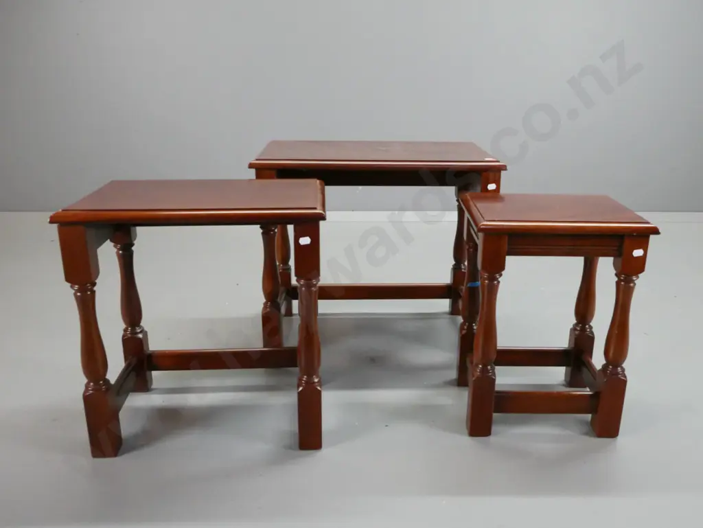 set of 3 mahogany nesting tables with turned legs, block feet and stretcher bases - minor ding to edge of large table Image 1++